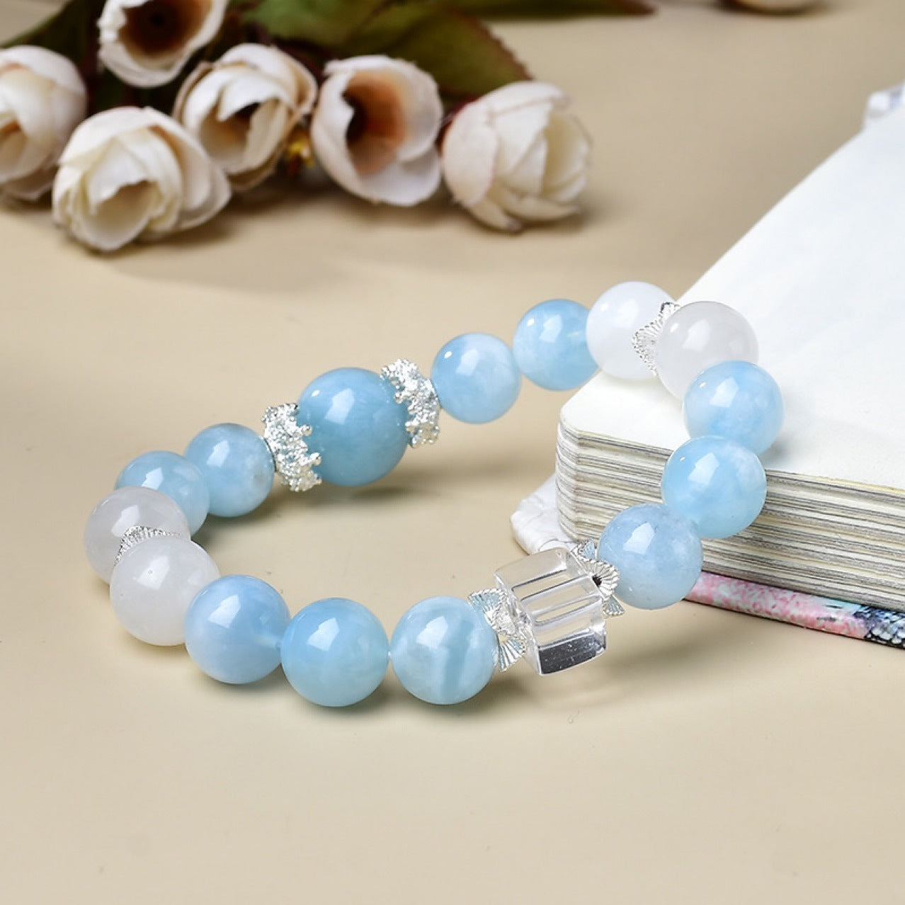 Women's healing bracelet with Aquamarine and Moonstone, laid flat showcasing stone colors and texture.